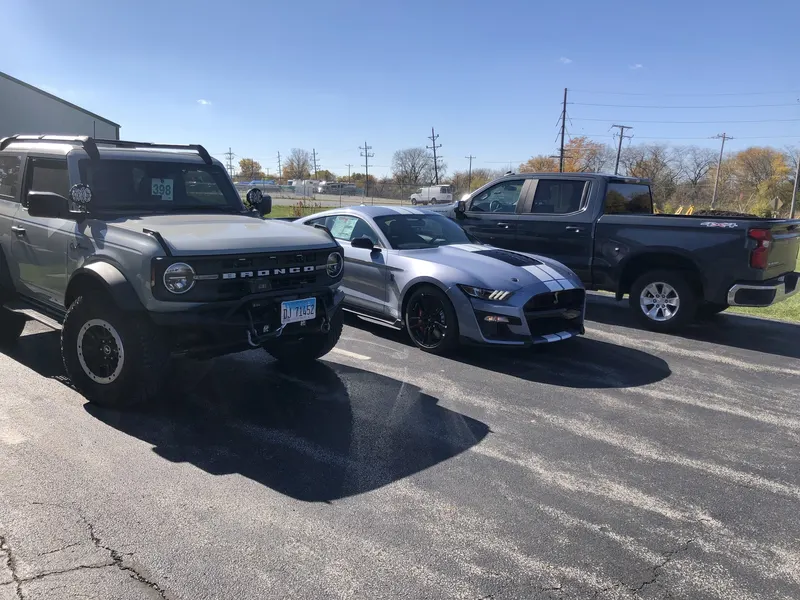 Refinished vehicles in the lot at St. Aubin Auto Body in Manteno